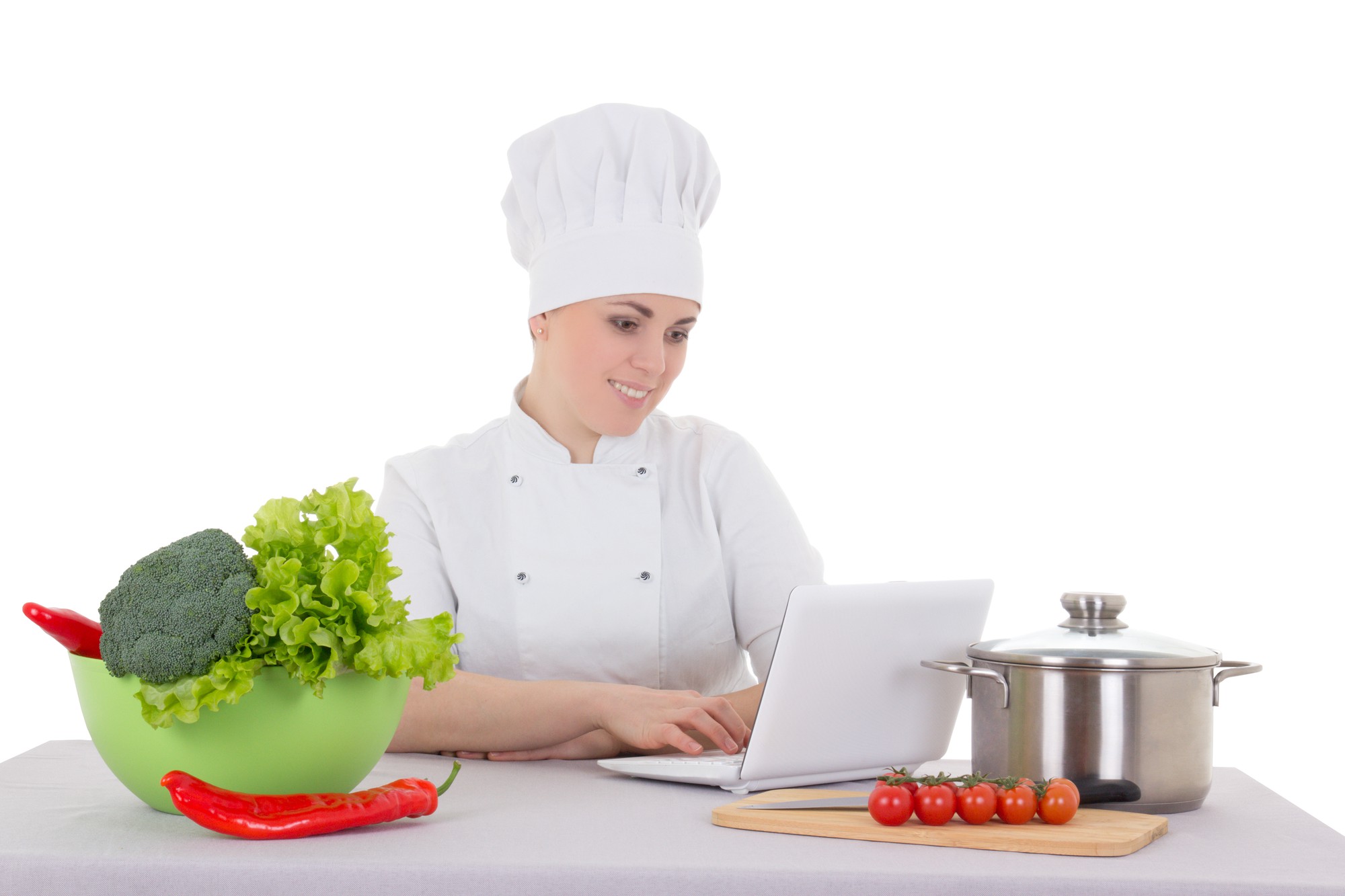 Chef teaching an online class with laptop and plated dish